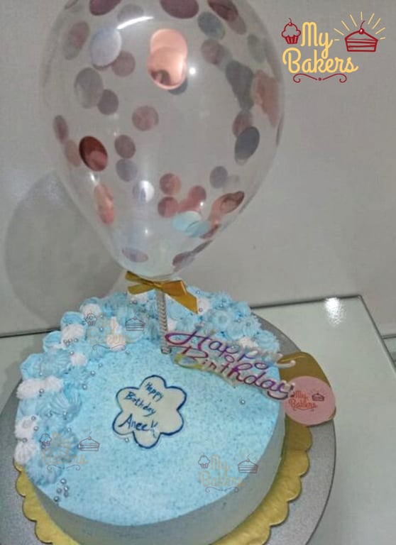 Cream Flower Cake with Silver Sprinkle Balls and Balloon Topper